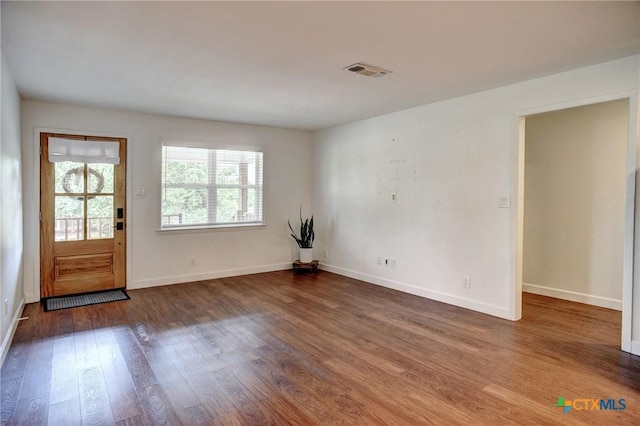 416 S Welhausen Ave, Shiner, TX 77984 - foyer entrance featuring wood finished floors and baseboards
