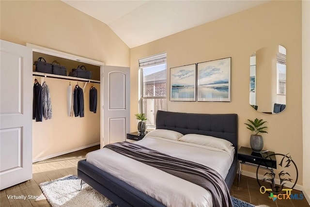 bedroom with a closet and vaulted ceiling