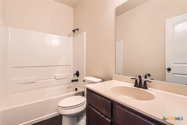 full bathroom with toilet, vanity, hardwood / wood-style floors, and  shower combination