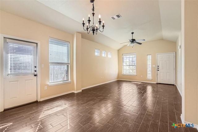 foyer entrance with lofted ceiling and ceiling fan with notable chandelier