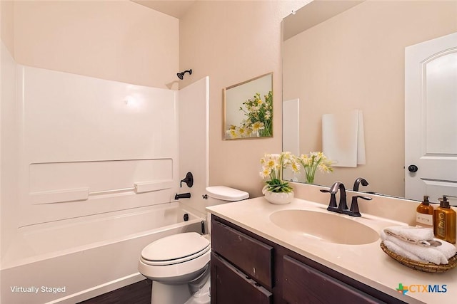 full bathroom with shower / tub combination, vanity, and toilet