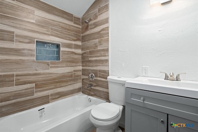 full bathroom featuring vanity, toilet, and tiled shower / bath combo