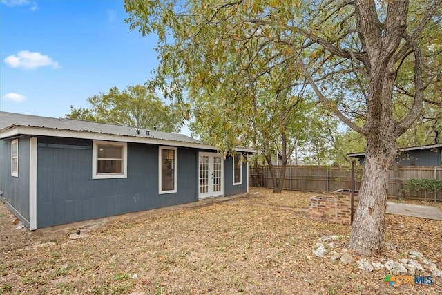 rear view of property featuring french doors