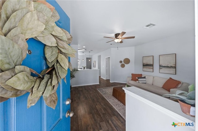 2215 Bellmont, Temple, TX 76504 - living room featuring dark wood-style floors, a ceiling fan, and baseboards