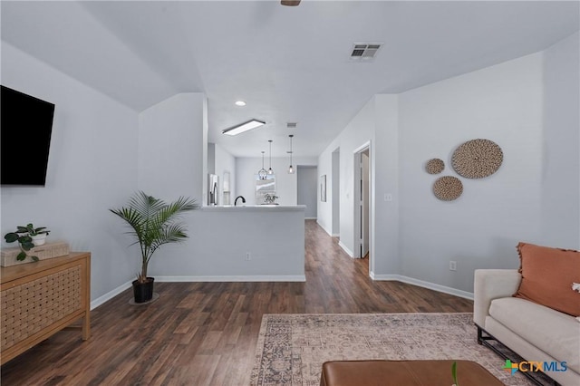 2215 Bellmont, Temple, TX 76504 - living room featuring dark wood finished floors, baseboards, and recessed lighting