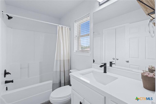 2215 Bellmont, Temple, TX 76504 - bathroom featuring toilet, vanity, and shower / bath combo with shower curtain