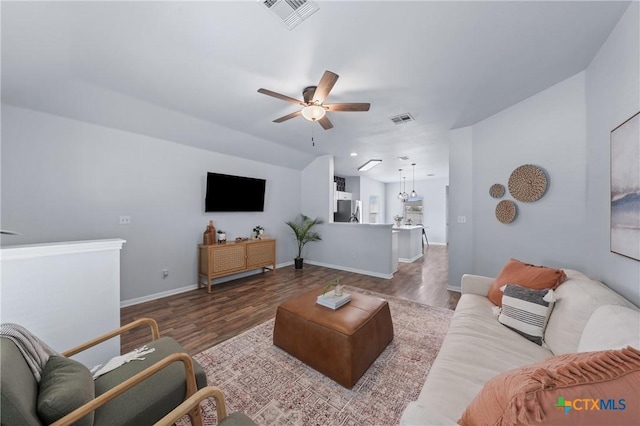 2215 Bellmont, Temple, TX 76504 - living area with a ceiling fan, wood finished floors, and baseboards