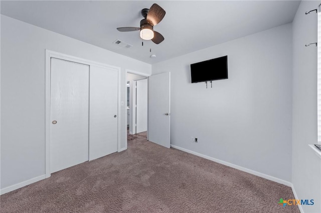 2215 Bellmont, Temple, TX 76504 - unfurnished bedroom with carpet, baseboards, a closet, and a ceiling fan