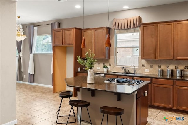 2303 Erica Kaitlin Ln, Cedar Park, TX 78613 - kitchen featuring a sink, stainless steel gas stovetop, backsplash, a kitchen island, and recessed lighting