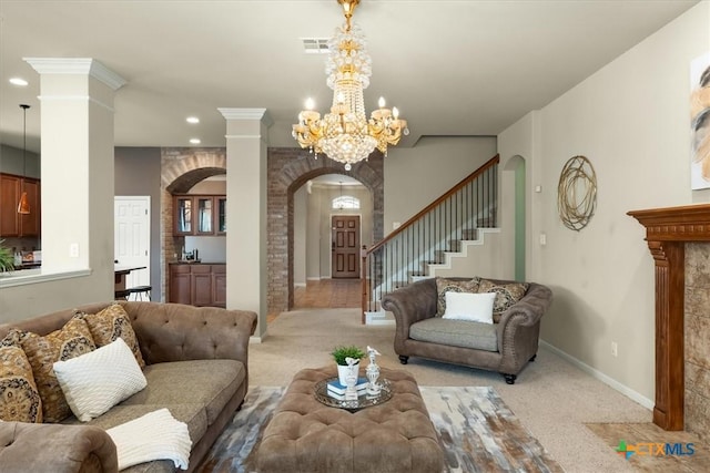 2303 Erica Kaitlin Ln, Cedar Park, TX 78613 - living area with arched walkways, light colored carpet, ornate columns, a chandelier, and recessed lighting