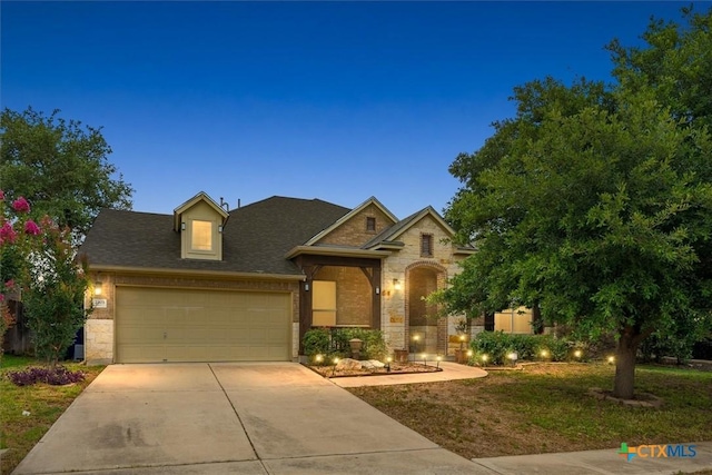 2303 Erica Kaitlin Ln, Cedar Park, TX 78613 - view of front of home featuring stone siding, driveway, a garage, and a front yard