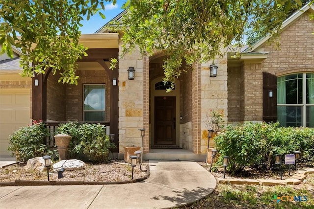 2303 Erica Kaitlin Ln, Cedar Park, TX 78613 - property entrance featuring stone siding and an attached garage
