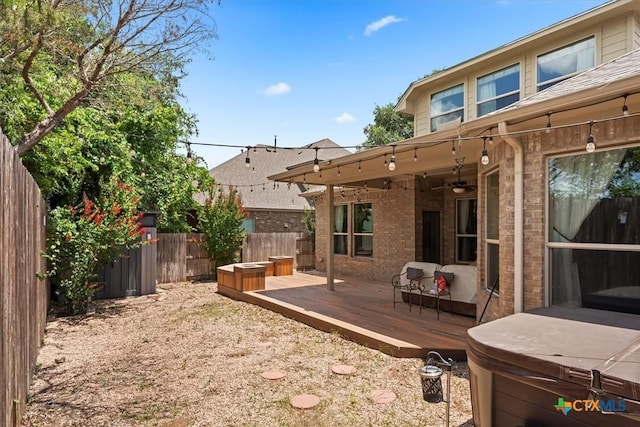 2303 Erica Kaitlin Ln, Cedar Park, TX 78613 - fenced backyard with a wooden deck and a ceiling fan