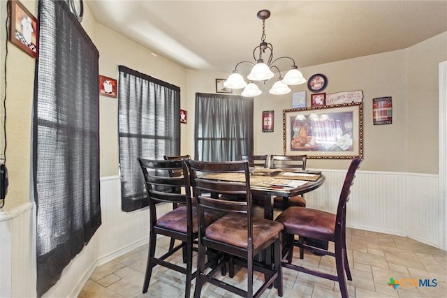 dining room with a chandelier