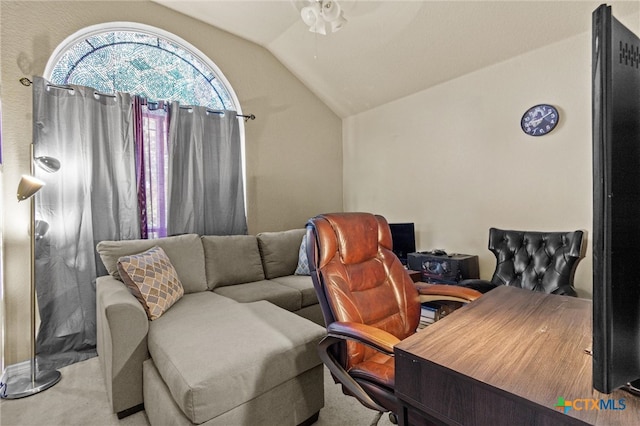 office space with vaulted ceiling, light carpet, and ceiling fan