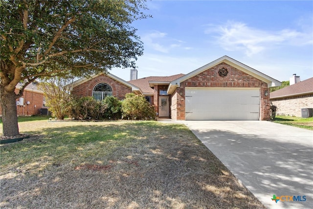 ranch-style home featuring a front lawn, a garage, and central AC