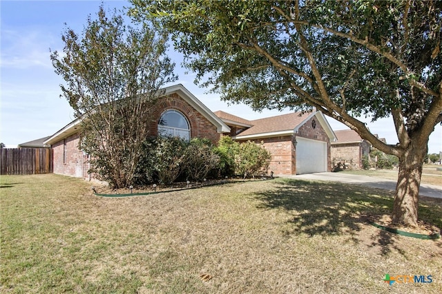 view of front of house with a garage and a front yard