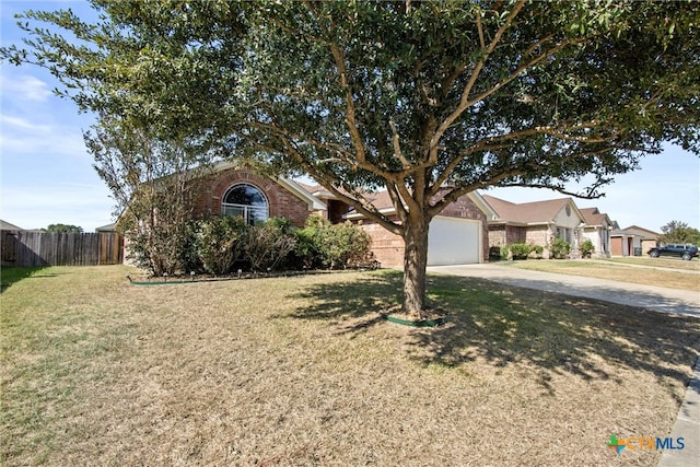 view of front facade featuring a garage and a front lawn