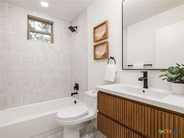 full bathroom featuring toilet, tub / shower combination, and vanity