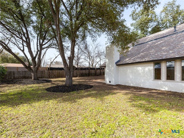 view of yard featuring fence