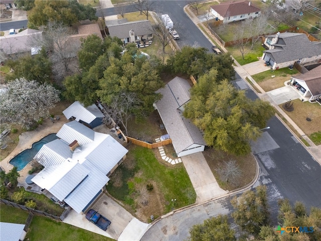 birds eye view of property with a residential view