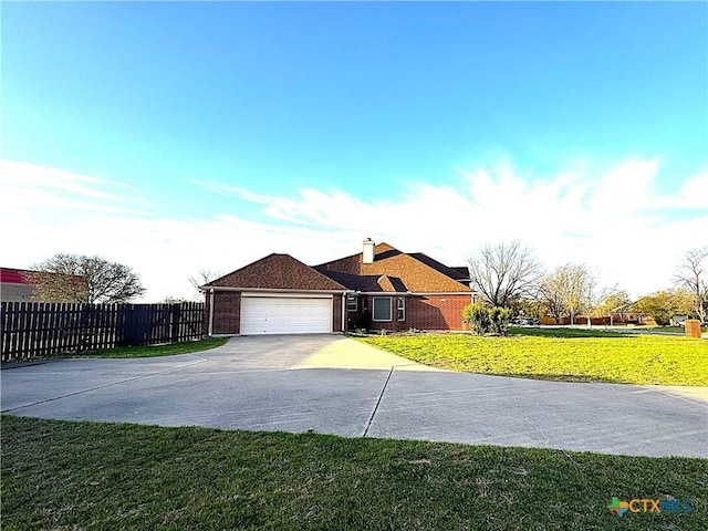 ranch-style home with concrete driveway, an attached garage, fence, a front lawn, and brick siding