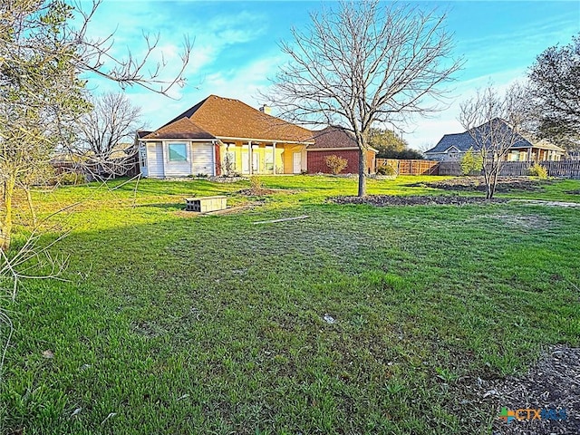 view of yard with fence