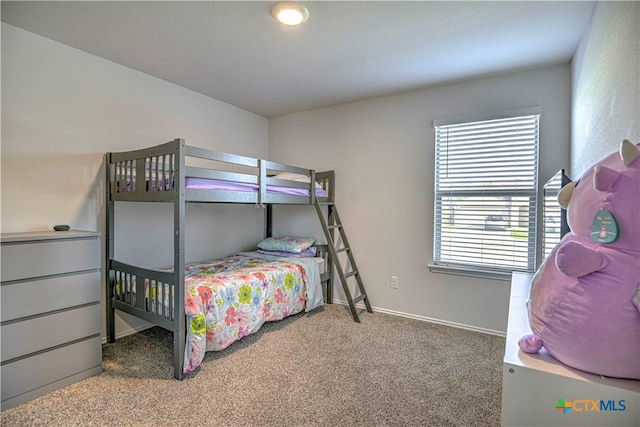 carpeted bedroom with baseboards