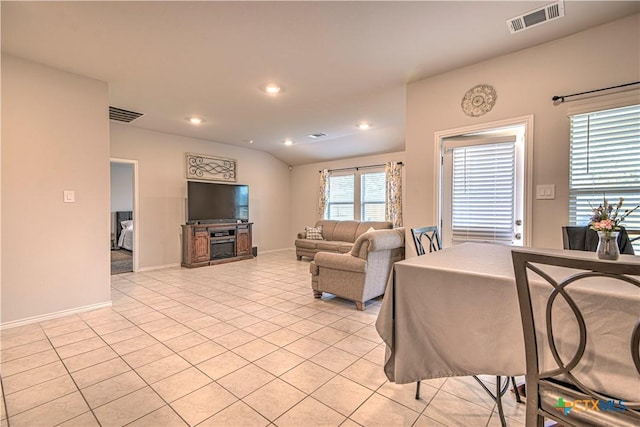 living room featuring light tile patterned floors, visible vents, and recessed lighting