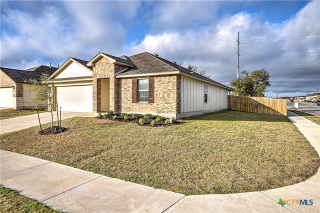 ranch-style home with fence, driveway, a front lawn, a garage, and brick siding