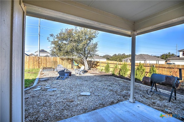 view of yard featuring a patio and a fenced backyard