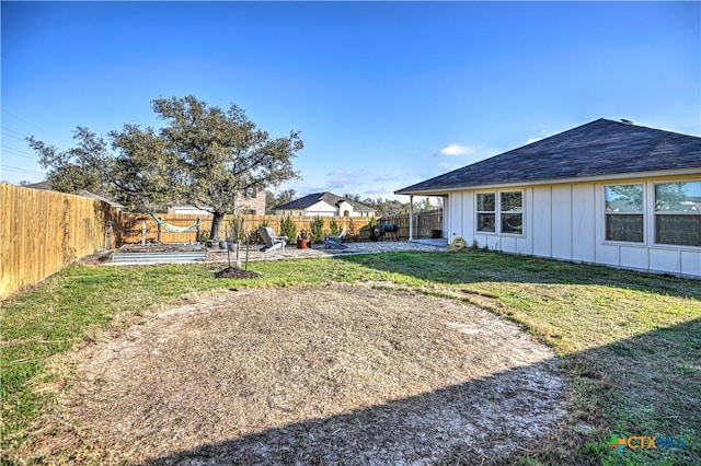 view of yard with a fenced backyard and a patio area