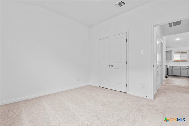 unfurnished bedroom with light carpet