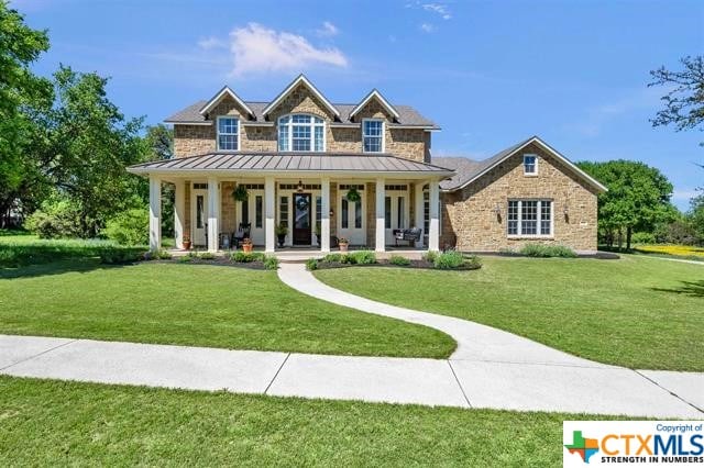 craftsman-style home with a porch and a front lawn