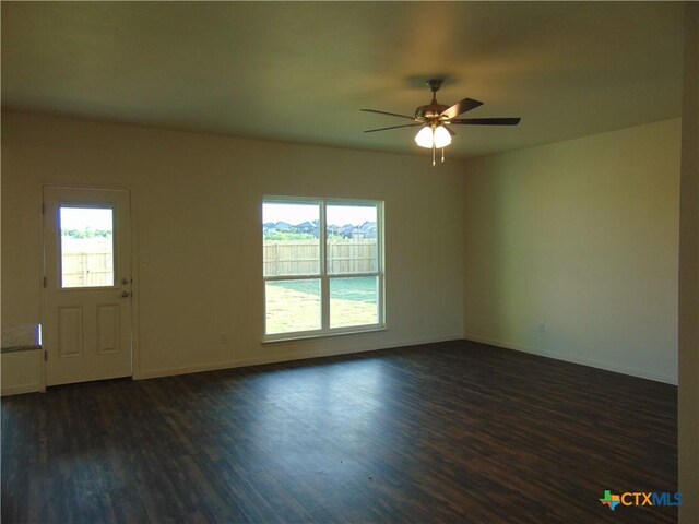 3204 Salt Fork Dr, Killeen, TX 76549 - spare room with dark wood-type flooring, ceiling fan, and baseboards