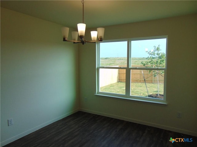 3204 Salt Fork Dr, Killeen, TX 76549 - empty room featuring a chandelier, baseboards, dark wood-style flooring, and plenty of natural light