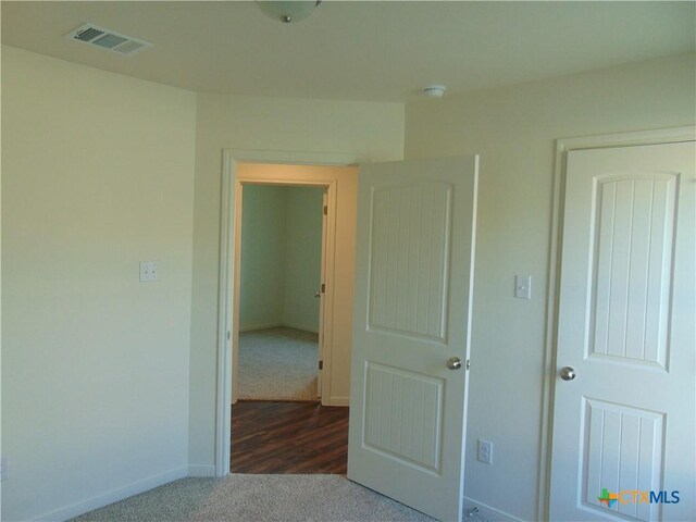 3204 Salt Fork Dr, Killeen, TX 76549 - unfurnished bedroom with dark carpet and baseboards