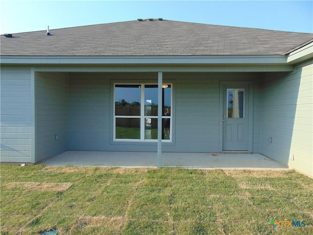 3204 Salt Fork Dr, Killeen, TX 76549 - back of property with a shingled roof, a lawn, and a patio area