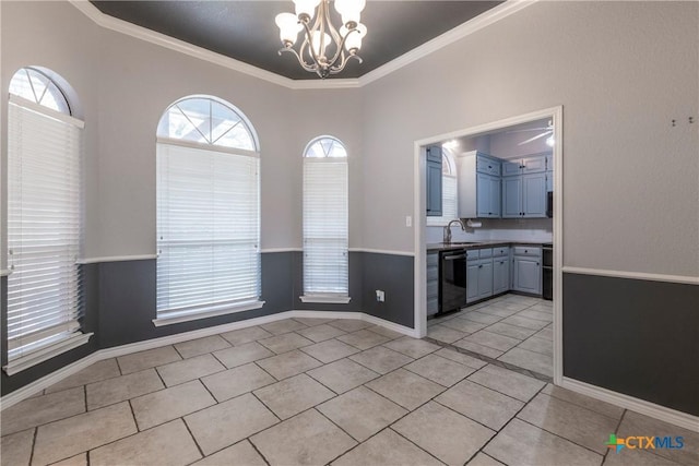 unfurnished dining area with light tile patterned floors, sink, crown molding, and a notable chandelier