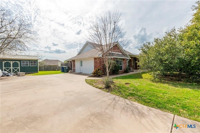 view of front of home with an outdoor structure and a front yard