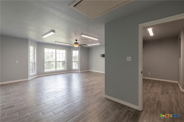 spare room with ceiling fan and a textured ceiling