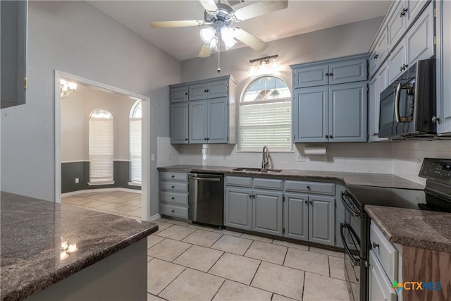 kitchen with black electric range oven, sink, stainless steel dishwasher, ceiling fan, and light tile patterned floors