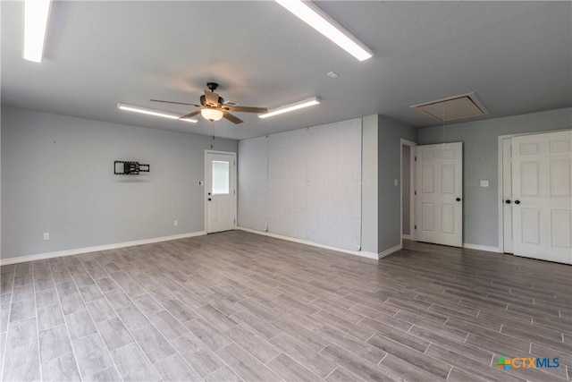 empty room featuring ceiling fan and light hardwood / wood-style flooring