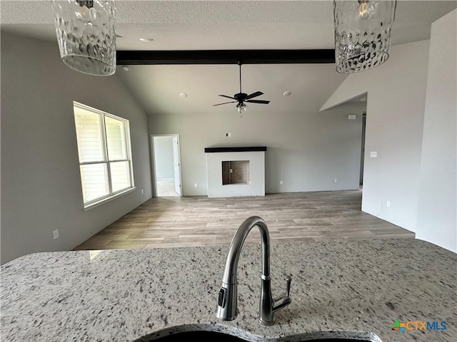 2571 Cedar Glen Dr, Belton, TX 76513 - unfurnished living room featuring a chandelier, ceiling fan, wood finished floors, and a textured ceiling