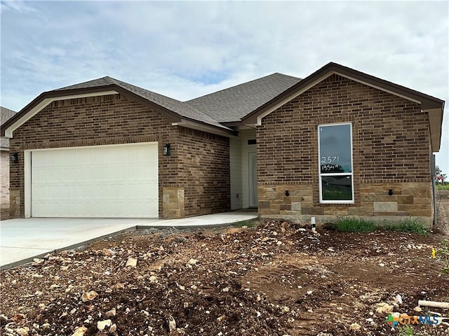 2571 Cedar Glen Dr, Belton, TX 76513 - ranch-style house with brick siding, a garage, driveway, and roof with shingles