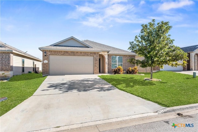 ranch-style home featuring a garage, brick siding, a shingled roof, concrete driveway, and a front yard