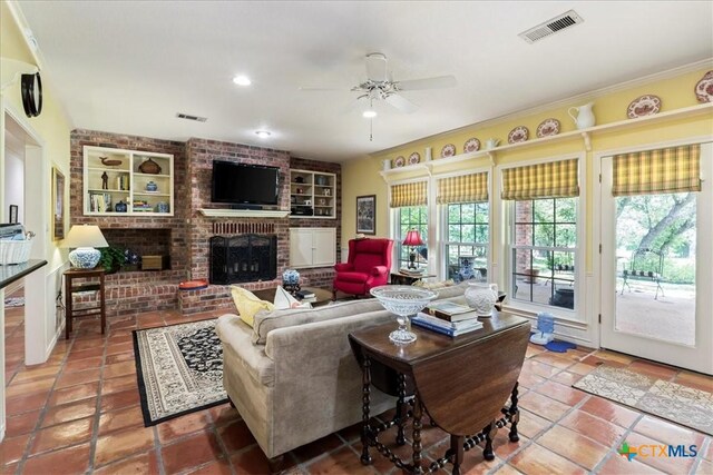 13650 Blackberry Rd, Salado, TX 76571 - tiled living room with ceiling fan, built in shelves, a fireplace, and recessed lighting