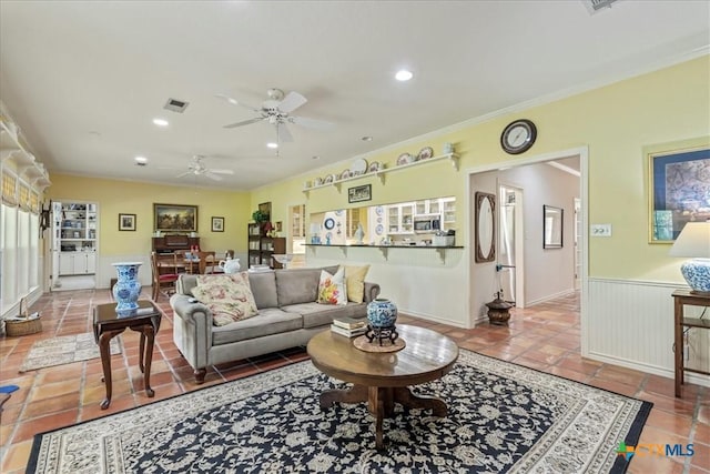 13650 Blackberry Rd, Salado, TX 76571 - tiled living room with ceiling fan, recessed lighting, wainscoting, and crown molding