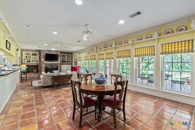 13650 Blackberry Rd, Salado, TX 76571 - dining area with recessed lighting, a ceiling fan, light tile patterned flooring, built in shelves, and a fireplace
