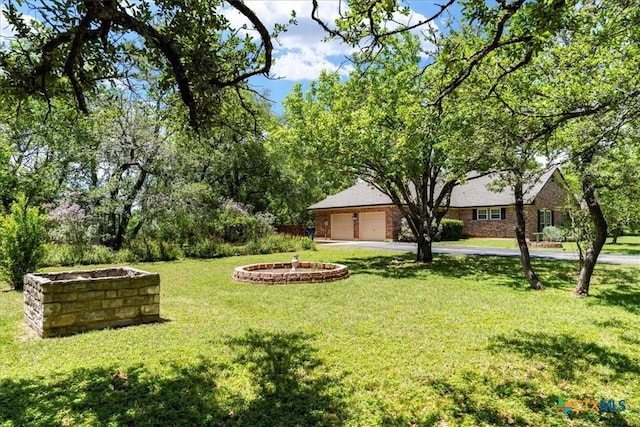 13650 Blackberry Rd, Salado, TX 76571 - view of grassy yard featuring asphalt driveway